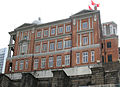 A red brick building viewed from a low angle.