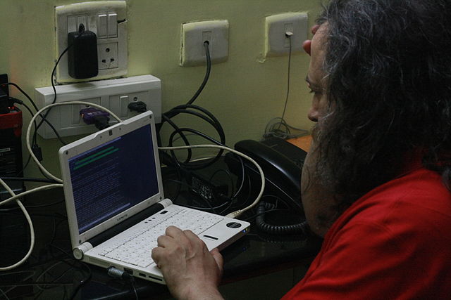 File:Richard Matthew Stallman working on his Lemote Machine.JPG
